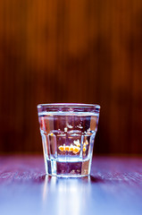 Alcoholic Tequila Silver cocktail shot with tabasco on a table