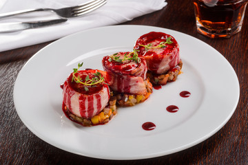 Three portions of pork medallions