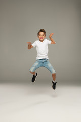 Fototapeta na wymiar Happy jumping boy