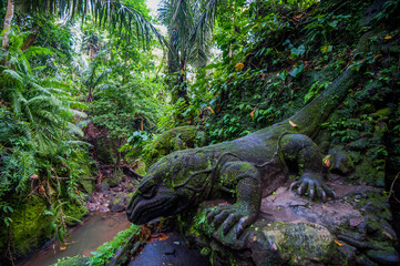 iguana statue in the forest