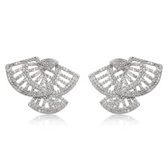 Pair of silver diamond earrings isolated on white