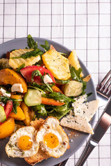 fried eggs and salad for breakfast, copy space, close-up, top view