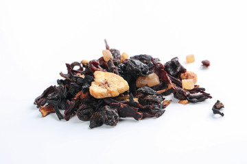 Still life, aromatic dry tea with fruits and petals