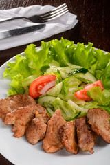 Vegetables salad with pork tenderloin