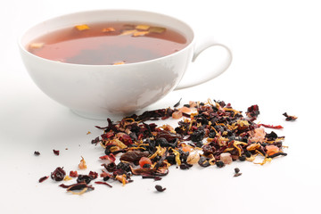 Still life, aromatic dry tea with fruits and petals