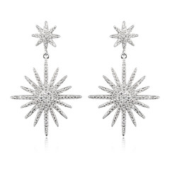 Pair of silver diamond earrings isolated on white