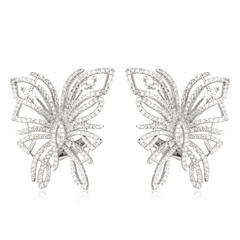 Pair of silver diamond earrings isolated on white