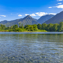 Wenatchee River with lush trees and huge mountain
