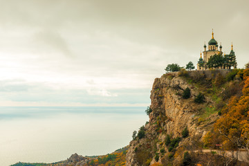 The rock, the sea and the beautiful Church of the Resurrection of Christ in Foros in the Crimea,...