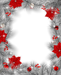 Frame of silver fir branches decorated with baubles  and poinsettia flowers on white background with space for text.
