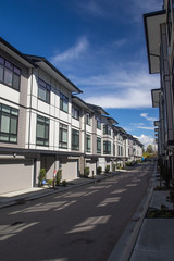 A row of a new townhouses. External facade of a row of colorful modern urban townhouses.brand new houses just after construction on real estate market