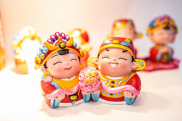 Fototapeta na wymiar Romantic cute Chinese traditional groom bride doll