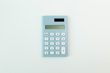 blue calculator white background  image close up.