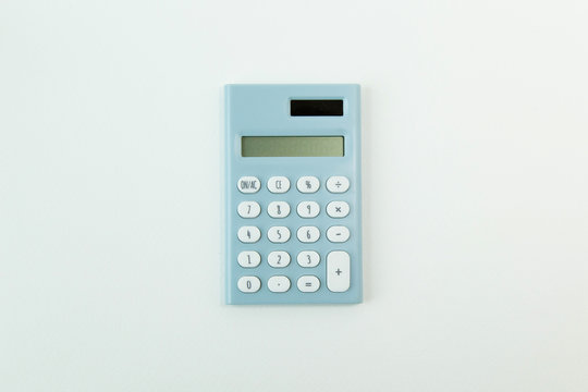 blue calculator white background  image close up.
