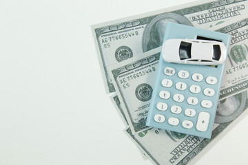 white car toy and blue calculator white background..