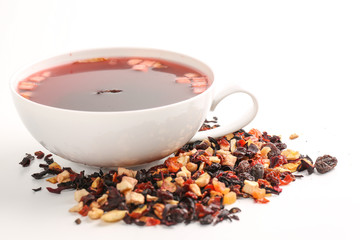 Still life, aromatic dry tea with fruits and petals