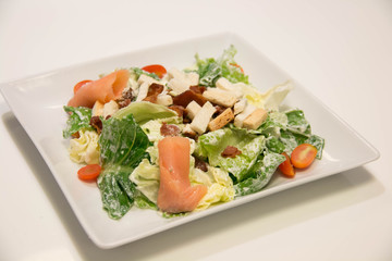  Caesar salad with salmon and parmesan cheese