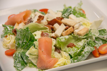  Caesar salad with salmon and parmesan cheese