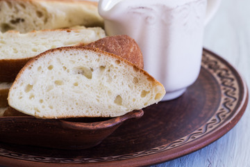 Homemade bread on a ceramic dish. Bread for traditional breakfast. Close-up.