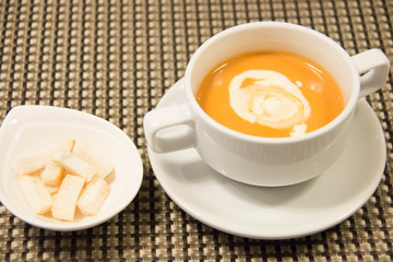  Pumpkin  soup with cream in  white cup