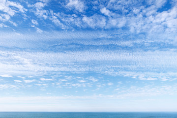 Fototapeta na wymiar Beautiful blue sky over the sea with translucent, white, Cirrus clouds