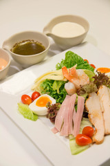  Mixed salad with chicken, ham, sauce, and vegetable