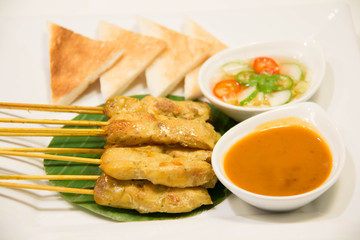 Grilled pork satay with peanut sauce