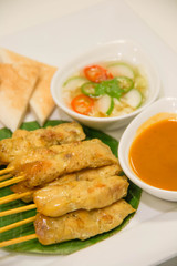 Grilled pork satay with peanut sauce
