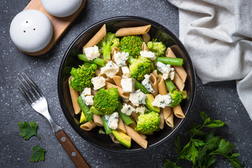 Whole-grain pasta penne with broccoli, avocado, green beans, pea