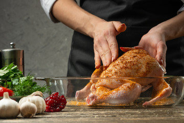 chef rub chicken with fruit spices close up, background for recipe book, menu