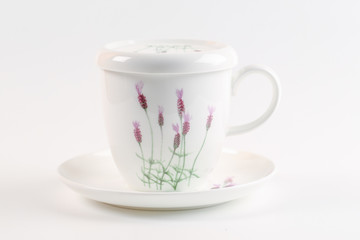close up of empty cup of tea on white