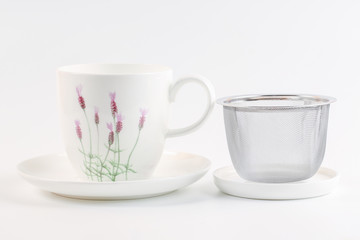close up of empty cup of tea on white