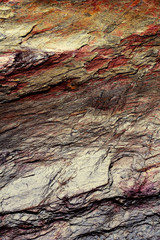 Stone structure background with metallic tones.