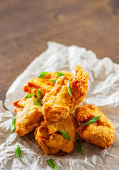 fried pieces of fish fillets on wooden table. fish nuggets