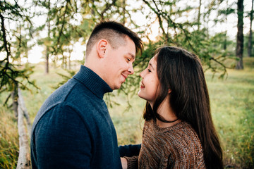 photo shoot of a beautiful brunette and her boyfriend in nature