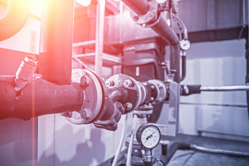 House heating system with many steel pipes, manometers and metal tubes, selective focus with light...