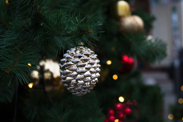 Beautiful Yellow White Christmas Ball On Spruce Branch Close Up.