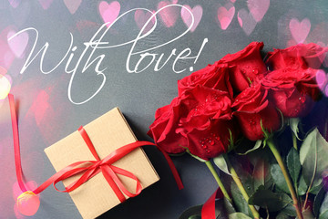 Bouquet of red roses and craft box with satin red ribbon, words of Declaration of love. Copy space. Holiday card for birthday, Valentine's day.