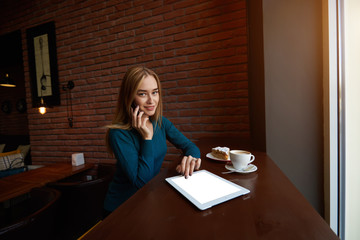 Young  female freelancer feeling upgrading software and browser settings on digital tablet...