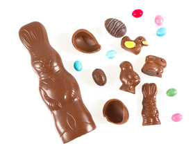 Easter composition with chocolate eggs and animals isolated on white