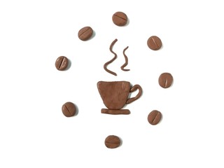 Delicious hot coffee made from plasticine clay and coffee beans arrange circle around it on white background, brown color dough 