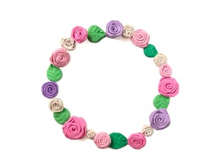 Beautiful pastel rose flowers arrange frame made from plasticine clay on white background, red and pink floral dough can use to decorate card messages