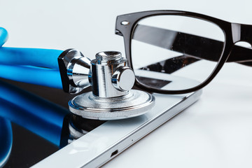 stethoscope and a digital tablet.