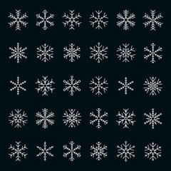 Vector collection of snowflakes, white icon on a black background