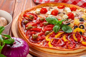 Delicious fresh pizza served on wooden table