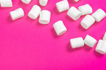 marshmallows on a pink background. top view