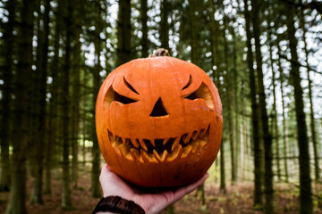 scary halloween pumpkin in the hand
