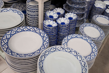 Plate and bowl vintage style in kitchenware shop. Pattern of blue and white in asia style.
