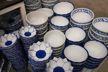 Plate and bowl vintage style in kitchenware shop. Pattern of blue and white in asia style.