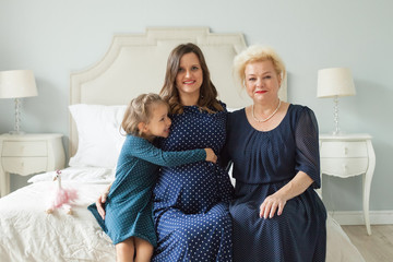 Grandmother with adult daughter and little granddaughter. Happy family